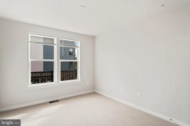 a view of swings and sign on a wall