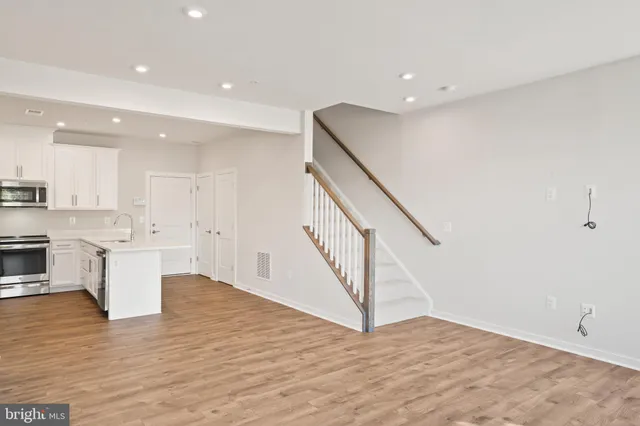a view of kitchen with wooden floor