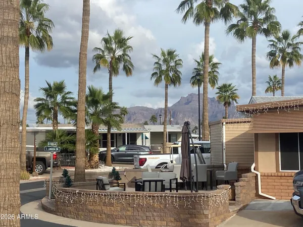 a front view of multiple houses with outdoor seating