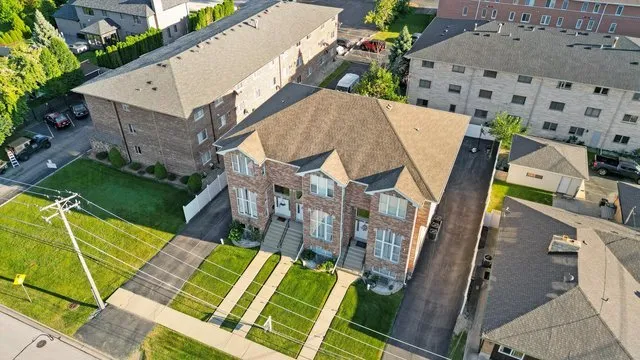 aerial view of a house with a yard