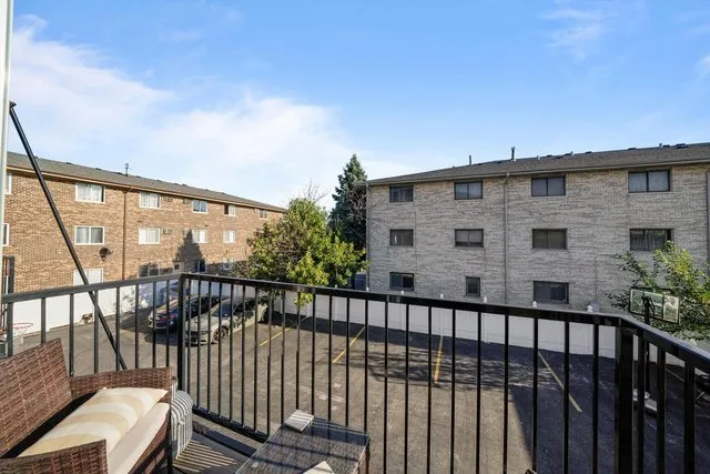 a view of a balcony with wooden floor