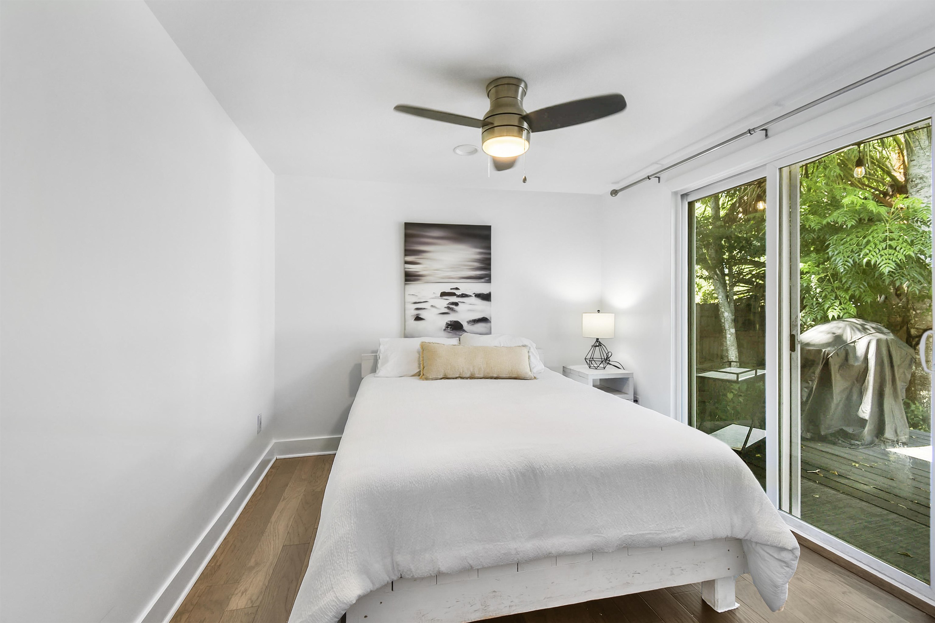 207 Spring Street St. Augustine, FL 32084 - Photo 23 of 32 a bedroom with a bed and a large window