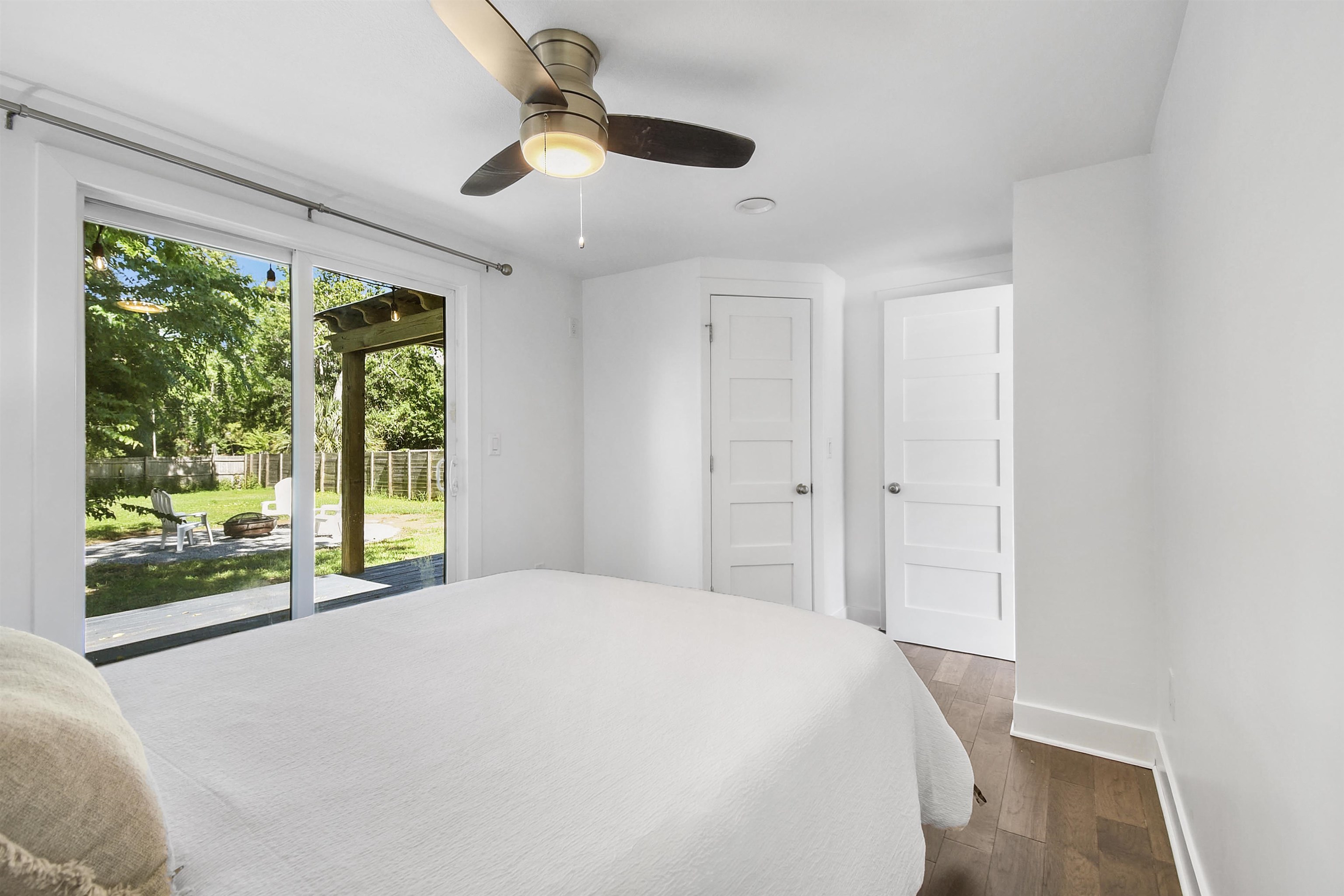 207 Spring Street St. Augustine, FL 32084 - Photo 24 of 32 a spacious bedroom with a large bed and a large window