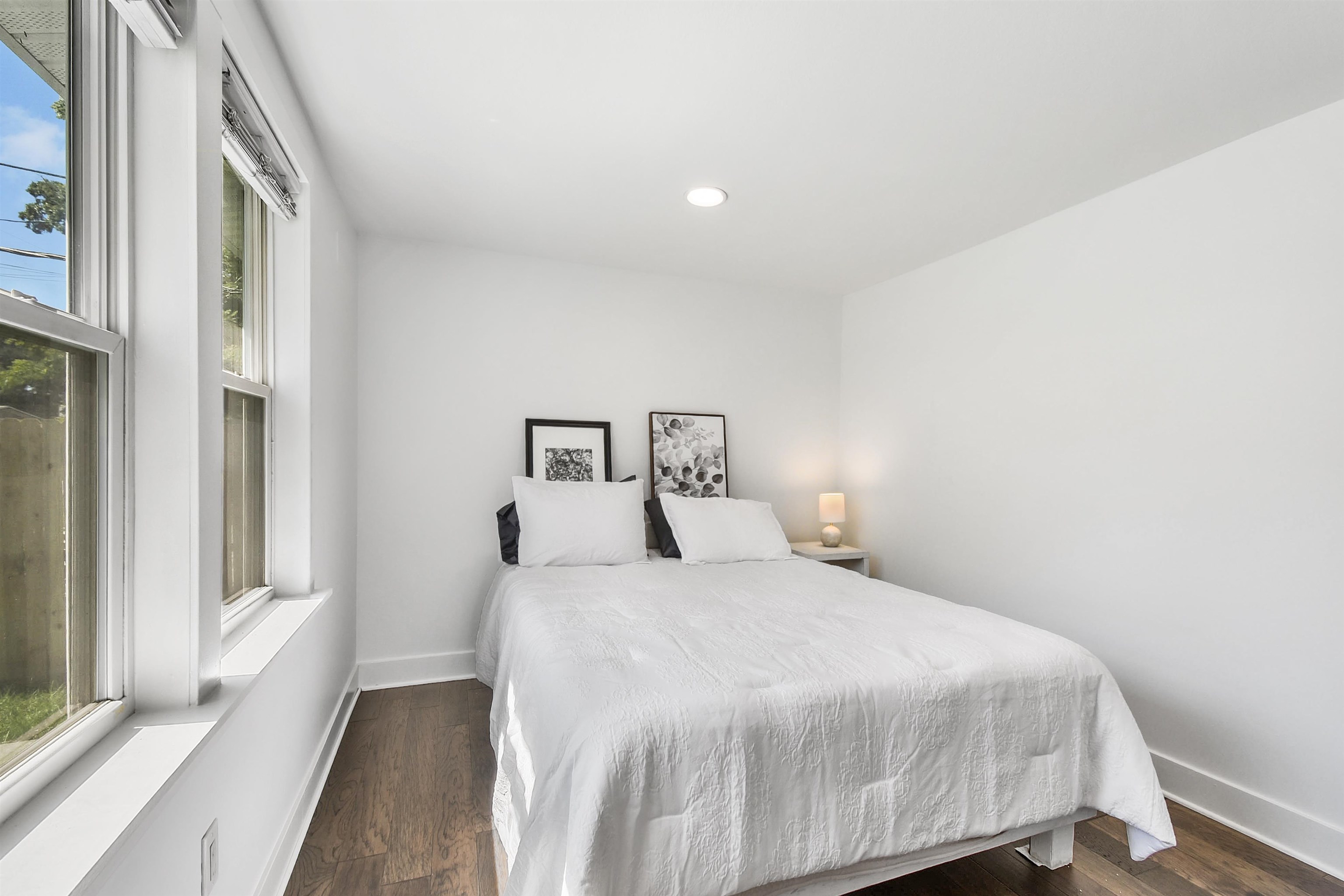 207 Spring Street St. Augustine, FL 32084 - Photo 27 of 32 a bedroom with a bed and a window