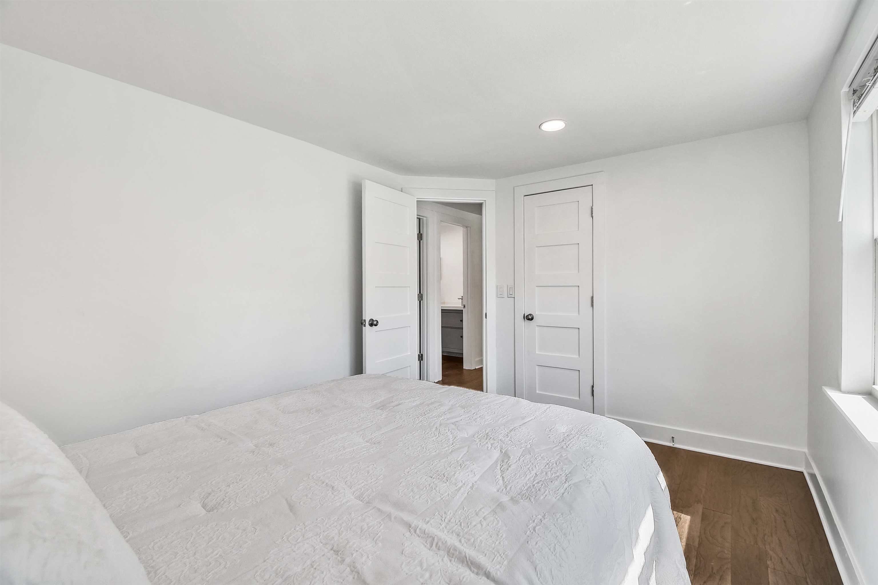 207 Spring Street St. Augustine, FL 32084 - Photo 29 of 32 a view of a big room with closet and wooden floor