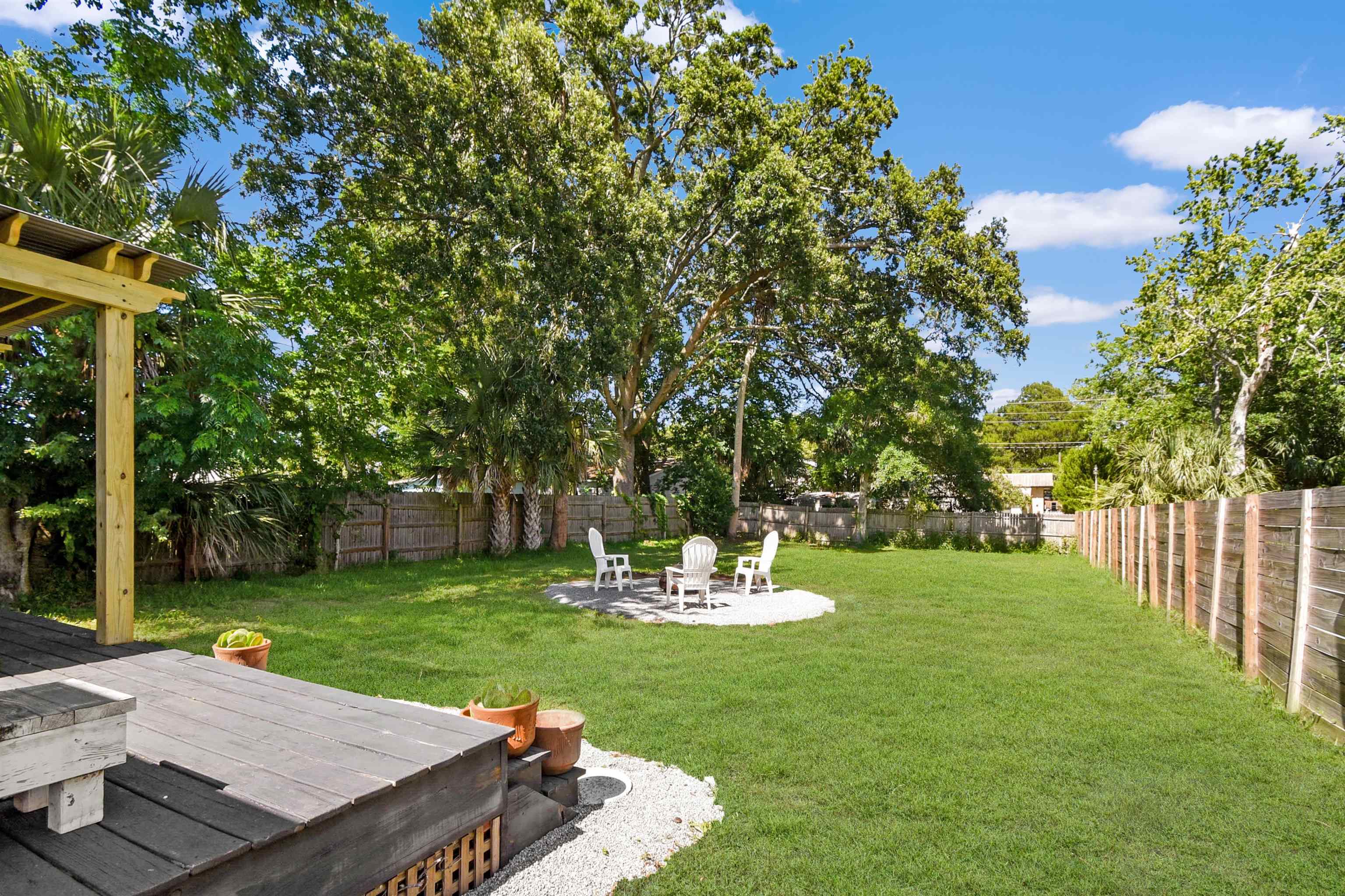 207 Spring Street St. Augustine, FL 32084 - Photo 10 of 32 a view of a backyard with sitting area