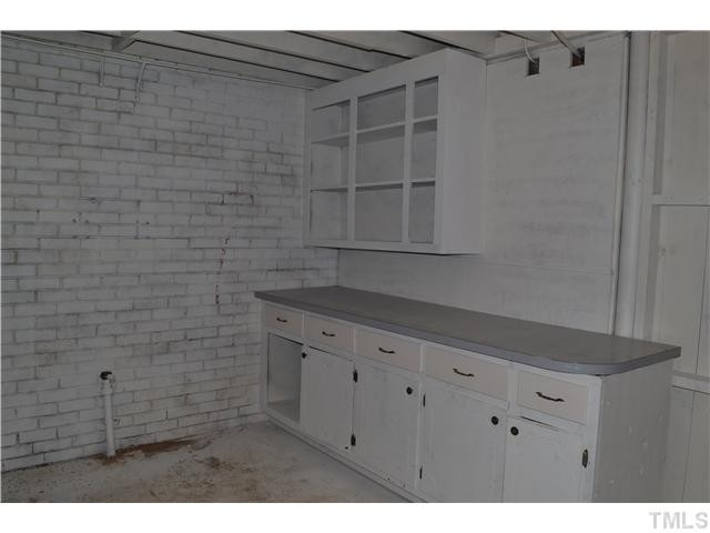 2524 Pickett Road Durham, NC 27705 - Photo 16 of 20 Another room in the basement with original repurposed cabinets that will be useful if you like to garden or for a hobby workshop. Lots of storage in this large basement. Basement