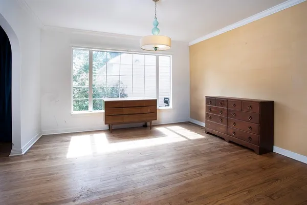 a living room with a couch and a rug