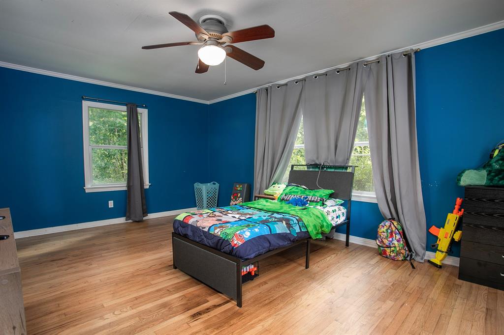 2414 South Martin Street Kilgore, TX 75662 - Photo 19 of 38 a bedroom with a bed and a window