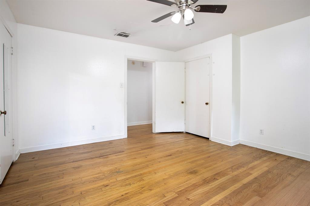 2414 South Martin Street Kilgore, TX 75662 - Photo 24 of 38 a view of an empty room with wooden floor