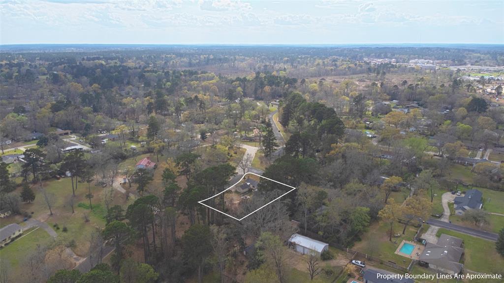 2414 South Martin Street Kilgore, TX 75662 - Photo 30 of 38 an aerial view of house with yard and mountain view in back