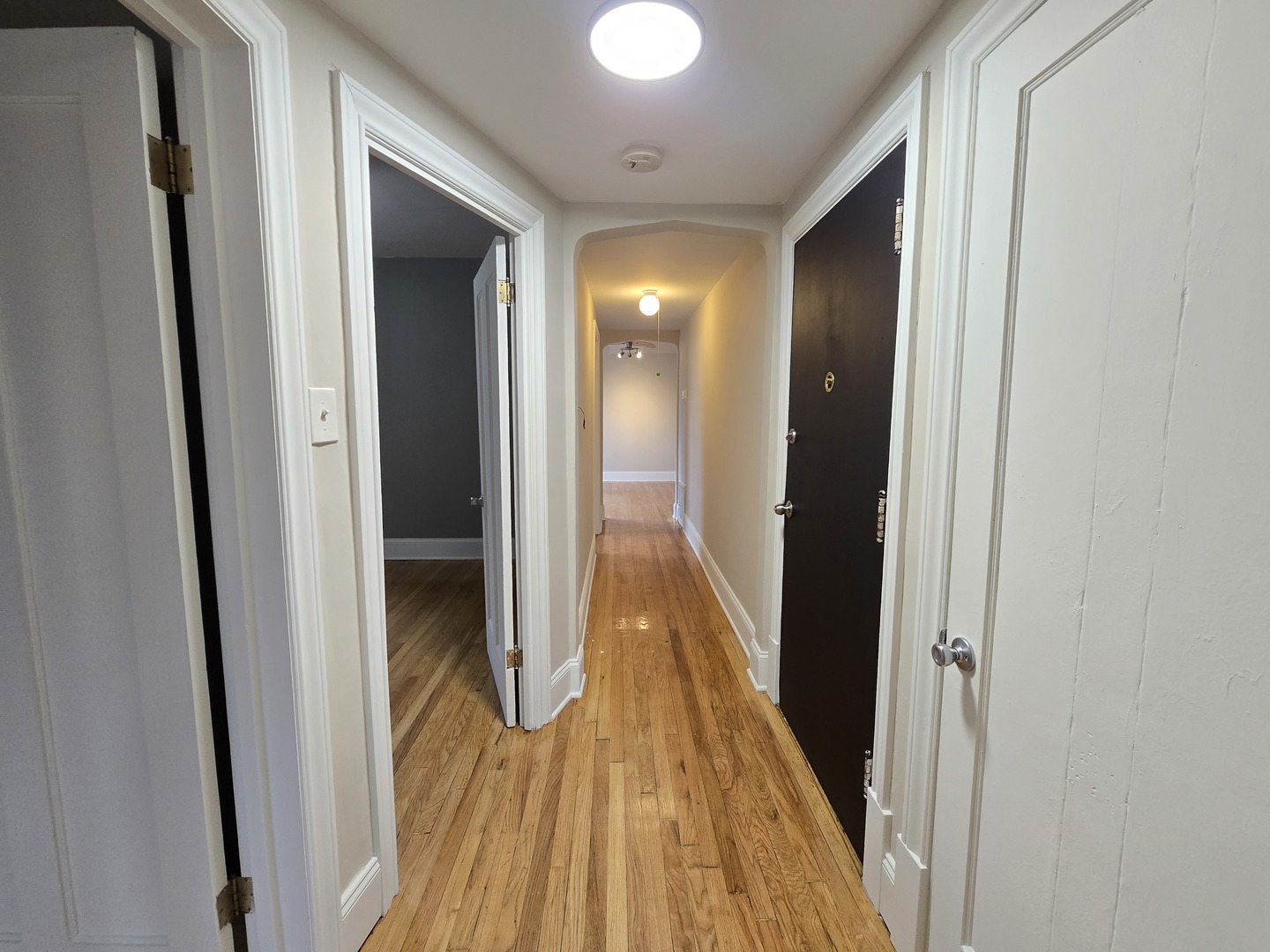 3507 West Belden Avenue, Unit 3 Chicago, IL 60647 - Photo 15 of 15 a view of a hallway with wooden floor and staircase