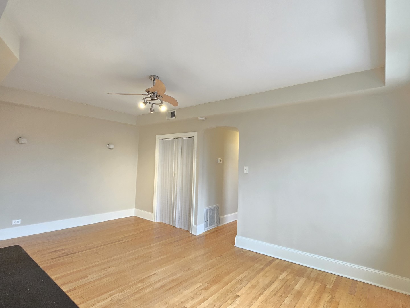 3507 West Belden Avenue, Unit 3 Chicago, IL 60647 - Photo 7 of 15 a big room with wooden floor and natural light