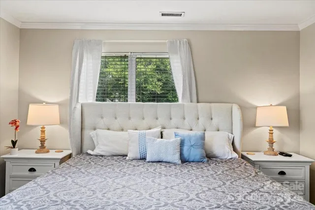 a bed room with a bed and a lamp