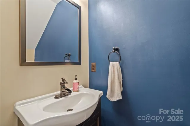 a bathroom with a sink and mirror