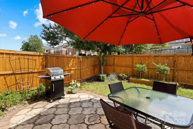 an aerial view of multiple houses with yard