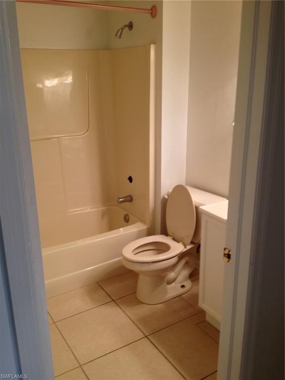 5339 Treetops Drive, Unit T105 Naples, FL 34113 - Photo 11 of 16 a bathroom with a toilet a sink and bathtub