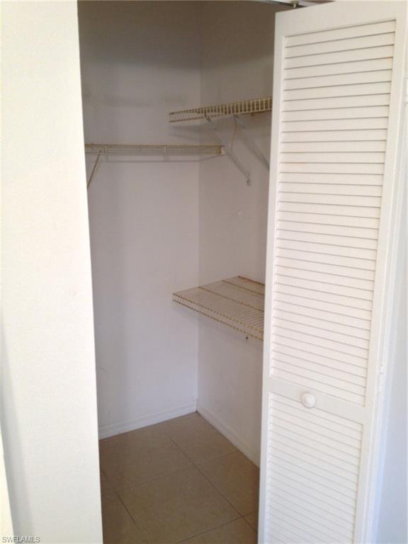 5339 Treetops Drive, Unit T105 Naples, FL 34113 - Photo 13 of 16 a view of small space with racks on the wall