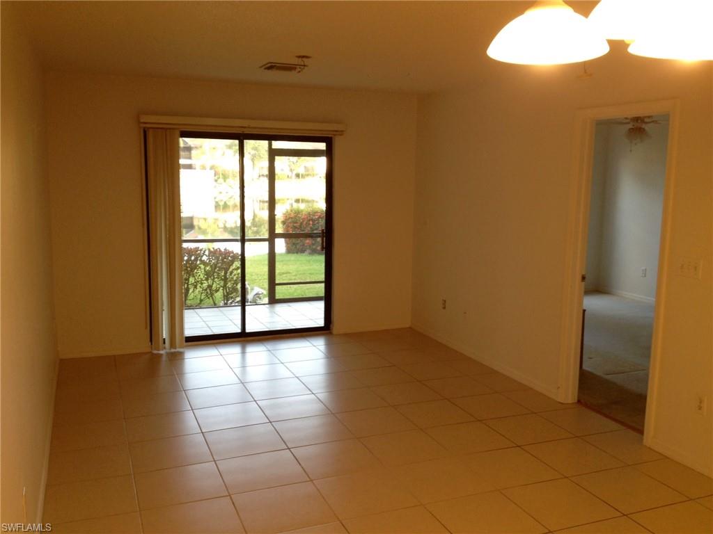 5339 Treetops Drive, Unit T105 Naples, FL 34113 - Photo 4 of 16 a view of a room with a large window