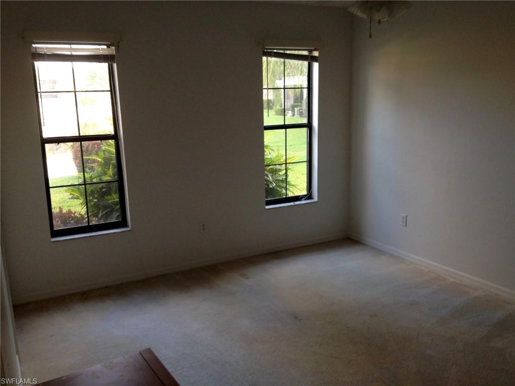 5339 Treetops Drive, Unit T105 Naples, FL 34113 - Photo 7 of 16 an empty room with a window