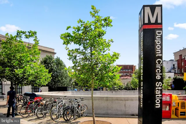 a view of a street with sitting area
