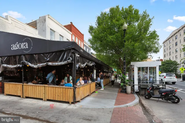 a view of a building with sitting area