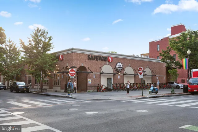 a group of people sitting in front of a building