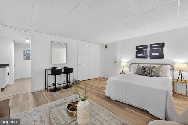 a bedroom with a bed and a table