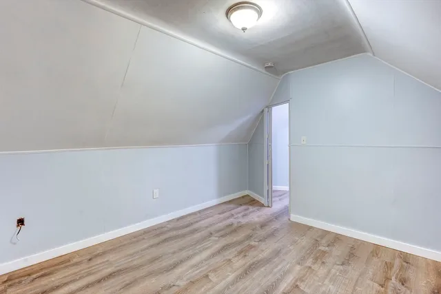 a bathroom with a sink toilet and a mirror