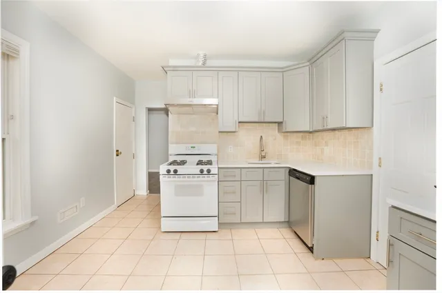 a kitchen with a cabinets and appliances