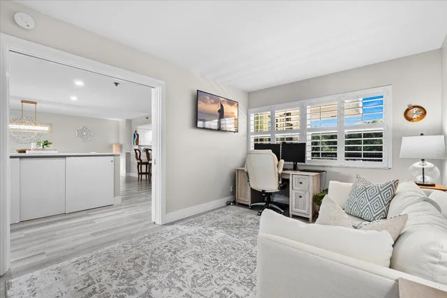 a bedroom with a bed dresser and a window