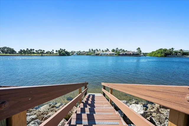 an aerial view of a house with a lake view