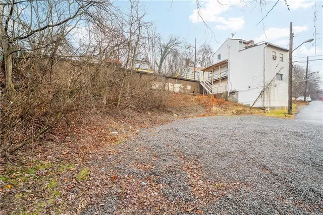 a view of outdoor space with playground and green space