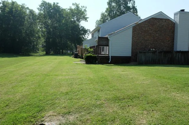 a view of a backyard with a house