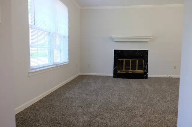 an empty room with a fireplace