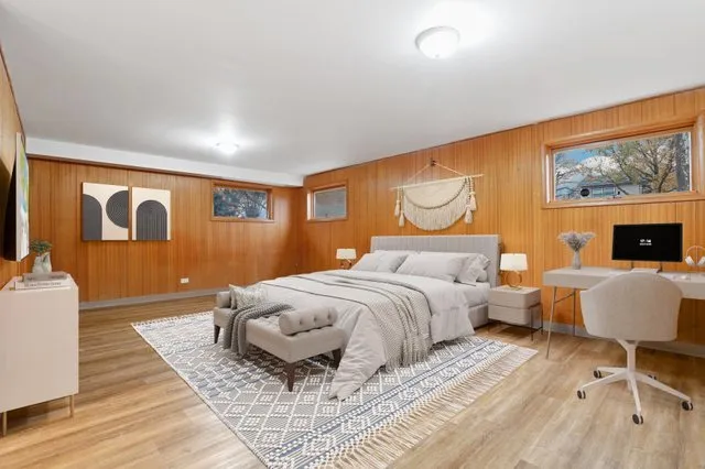 a bedroom with a large bed and a couch