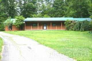 322 Slabtown Road Zionville, NC 28698 - Photo 1 of 1 a front view of a house with a garden and yard