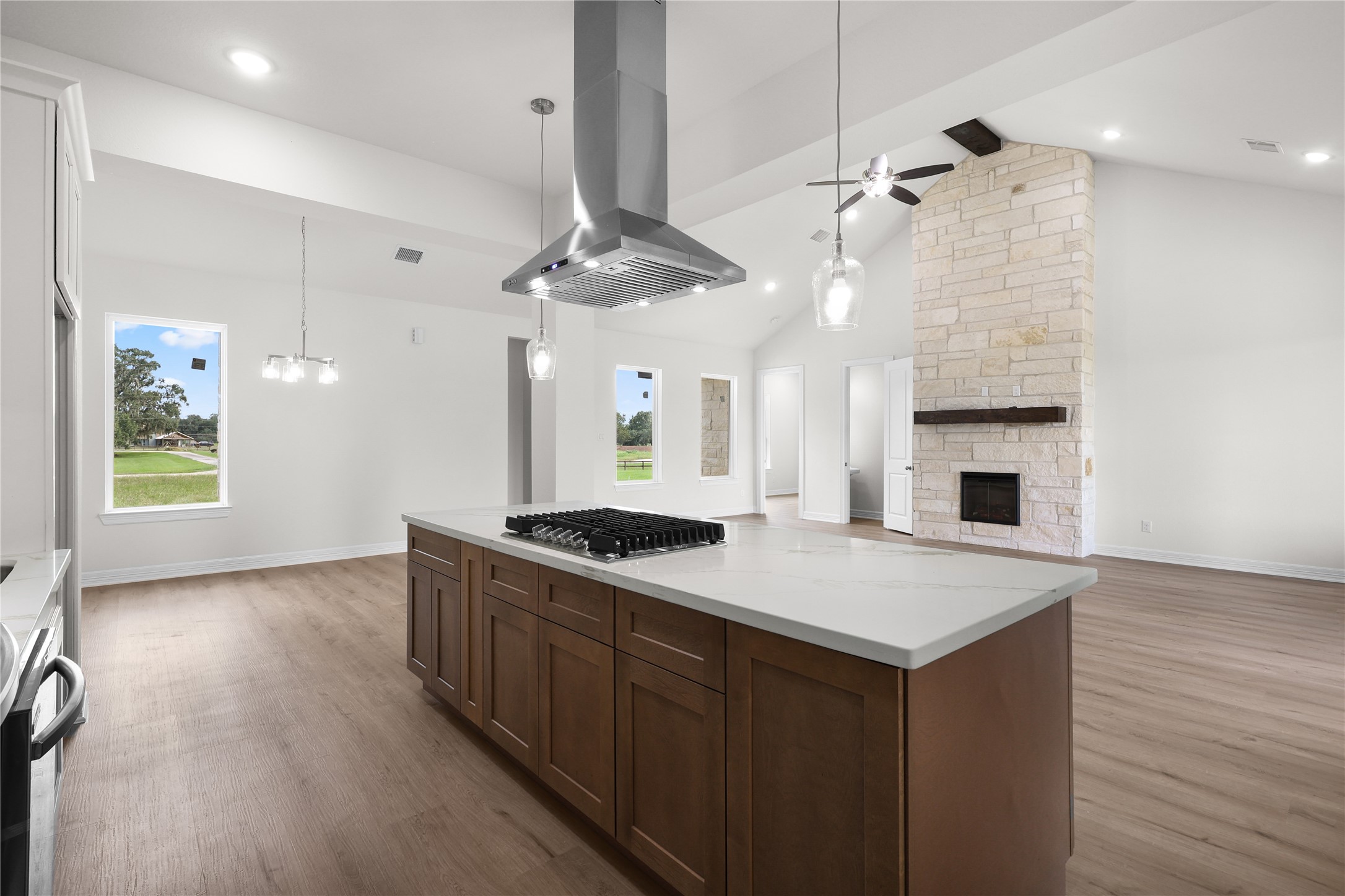 1720 Flintlock Court Angleton, TX 77515 - Photo 11 of 32 a kitchen with a stove and a kitchen island