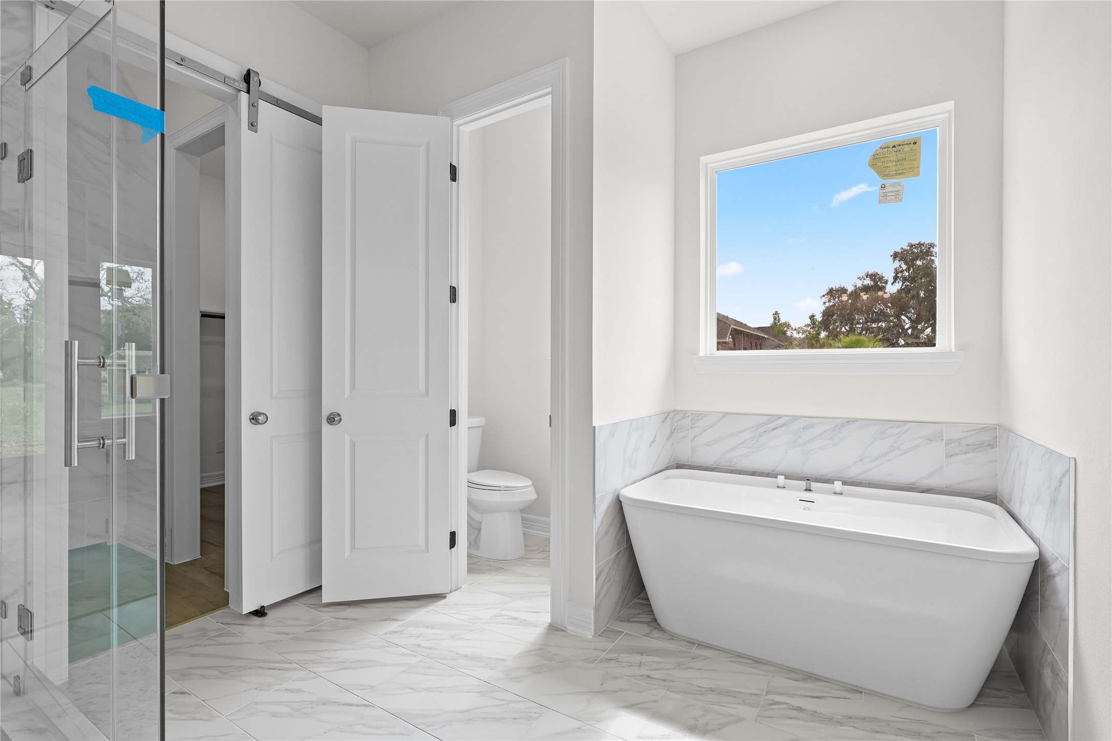 1720 Flintlock Court Angleton, TX 77515 - Photo 18 of 32 a bathroom with a bathtub and a shower