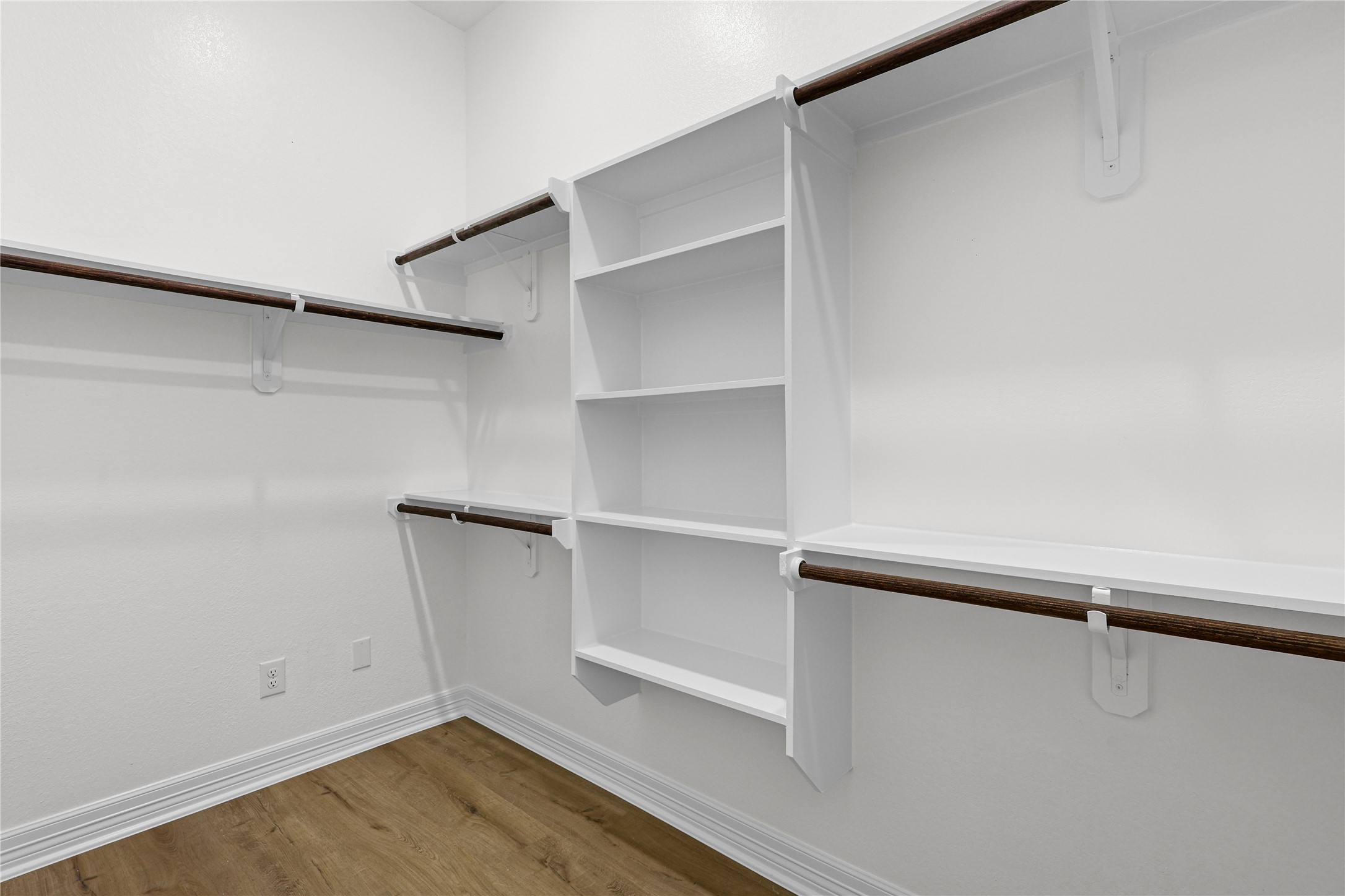 1720 Flintlock Court Angleton, TX 77515 - Photo 19 of 32 a view of an empty walk in closet