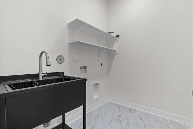 a close view of a sink and cabinets