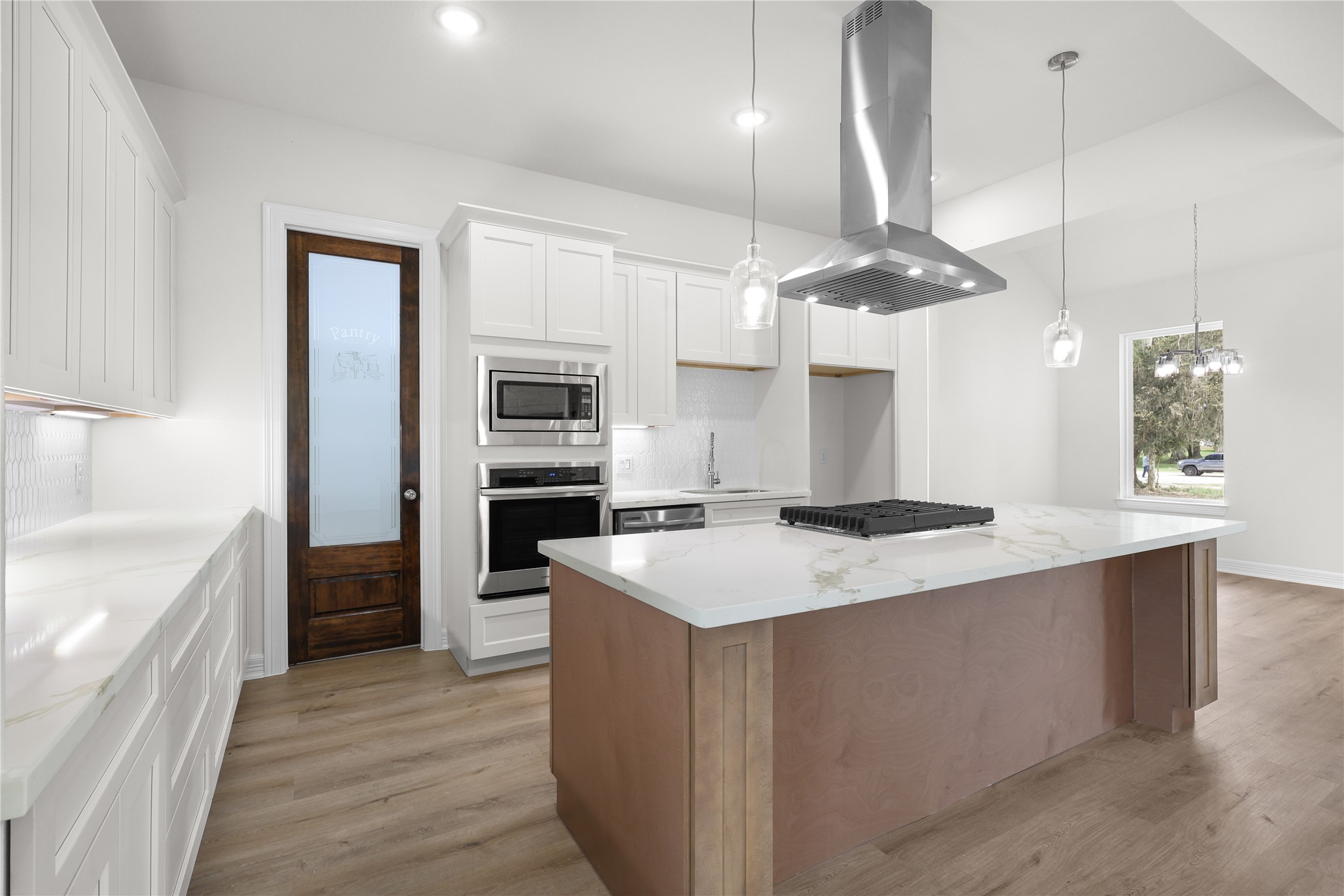 1720 Flintlock Court Angleton, TX 77515 - Photo 10 of 32 large kitchen with stainless steel appliances granite countertop a sink a stove and a refrigerator