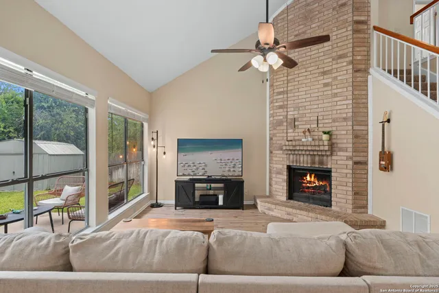 a living room with furniture and a fireplace