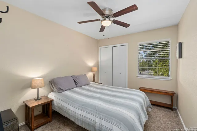 a bedroom with a bed and a window