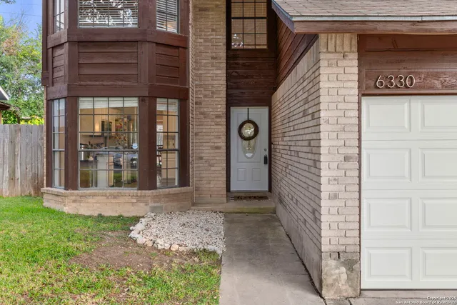 a view of a pathway of a house with a small porch