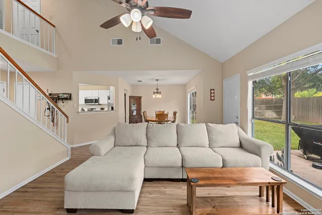 a living room with furniture and a large window