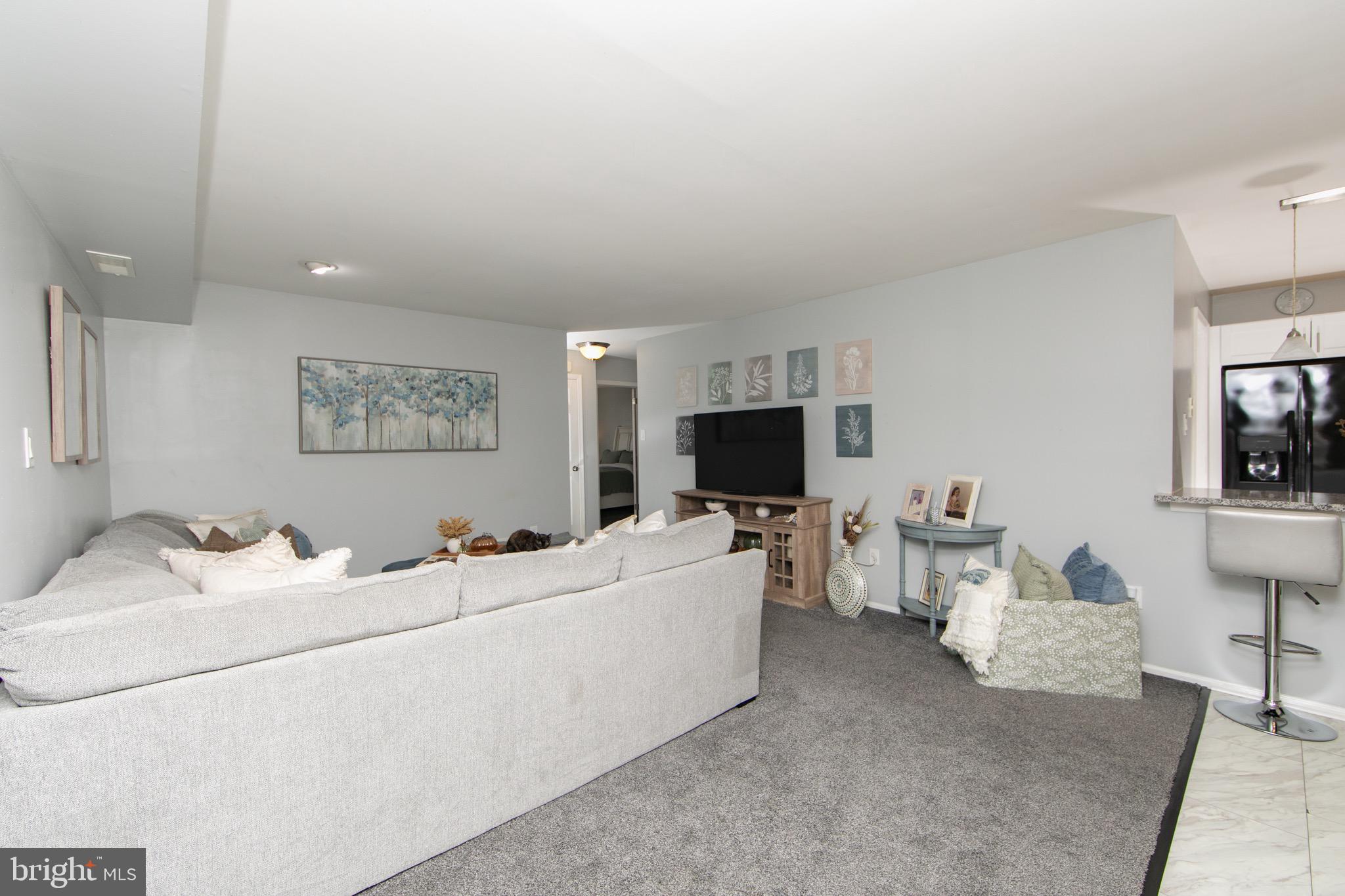 123 Birchfield Court Mount Laurel, NJ 08054 - Photo 2 of 32 a living room with furniture and a flat screen tv