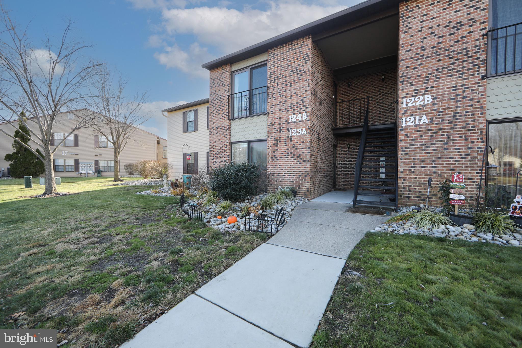 123 Birchfield Court Mount Laurel, NJ 08054 - Photo 27 of 32 a front view of a house with a garden
