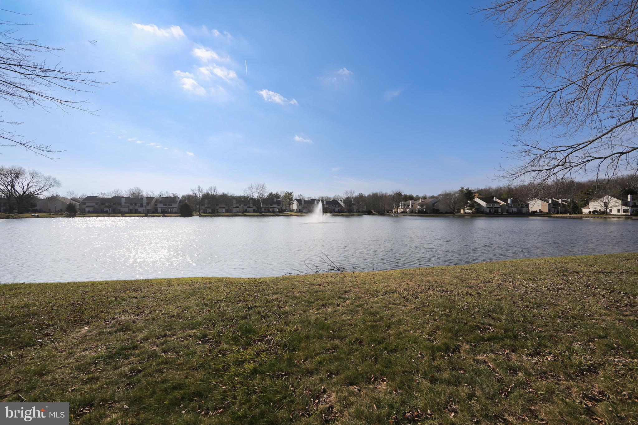 123 Birchfield Court Mount Laurel, NJ 08054 - Photo 31 of 32 a view of a lake with houses in the background