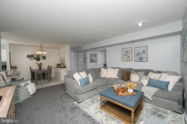 a living room with furniture and a table